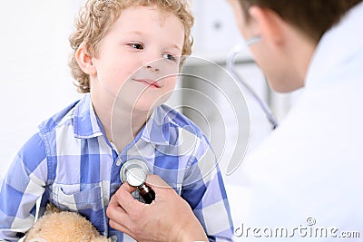 Doctor examining a child patient by stethoscope Stock Photo