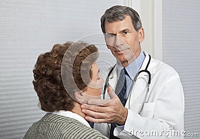 Doctor Examining Female Patient for Flu Symptoms