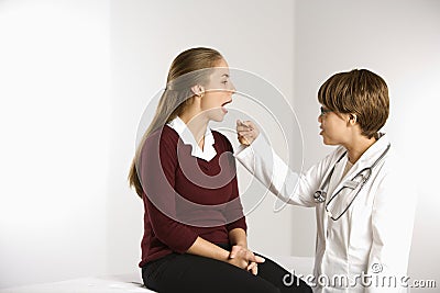 Doctor examining patient. Stock Photo