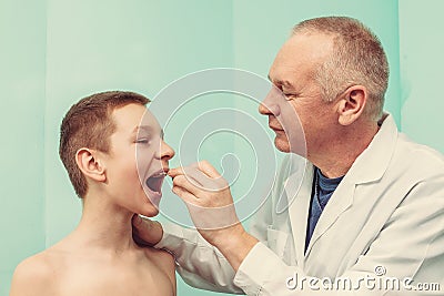 Doctor examining patient s mouth Stock Photo