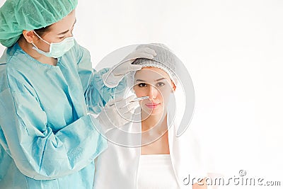 The doctor is examining woman undergo surgery Stock Photo
