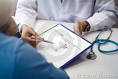 Doctor explain health check document of male patient in medical clinic or hospital health. health and doctor concept Stock Photo