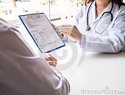 The doctor explained the health examination results to the patient Stock Photo