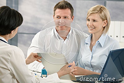 Doctor explaining medical diagnosis to patients Stock Photo