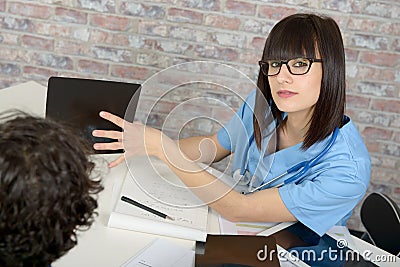 Doctor explaining x-ray results to patient Stock Photo