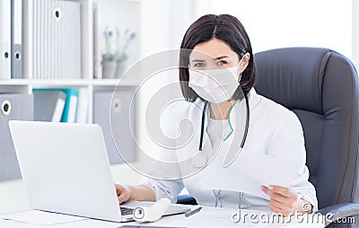 Doctor in face mask at work Stock Photo