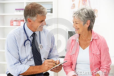 Doctor with female patient Stock Photo