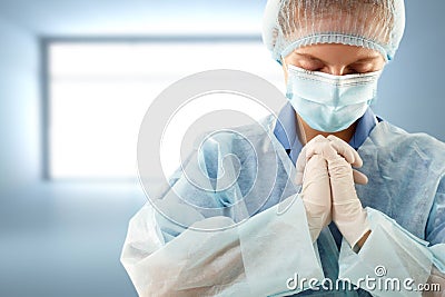 Doctor female praying Stock Photo