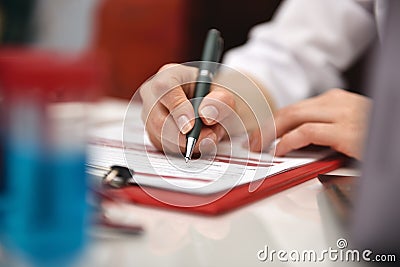 Doctor Filling Medical History Stock Photo