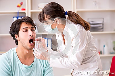 The doctor getting saliva test sample in clinic hospital Stock Photo