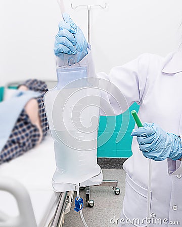 Doctor gives her patient for enema to resolve constipation problem. Stock Photo