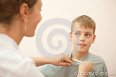 Doctor gives thermometer little boy Stock Photo