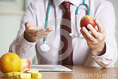 Doctor Giving Advice On Healthy Diet Stock Photo