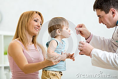 Doctor giving medicament with a spoon Stock Photo