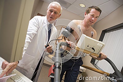 Doctor Giving Patient Health Check Stock Photo