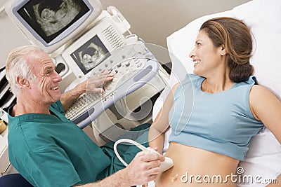 Doctor Giving Patient An Ultra Sound Stock Photo