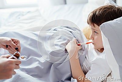 Doctor giving sick child a syrup Stock Photo