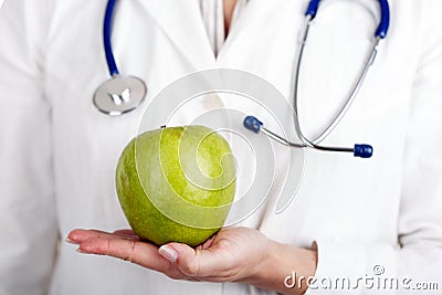 Doctor and green apple Stock Photo