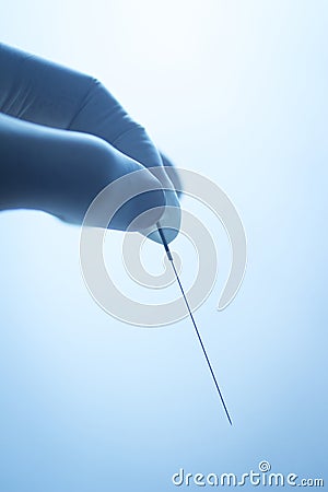 Doctor hand acupuncture needle dry needling Stock Photo