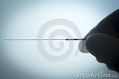 Doctor hand acupuncture needle dry needling Stock Photo