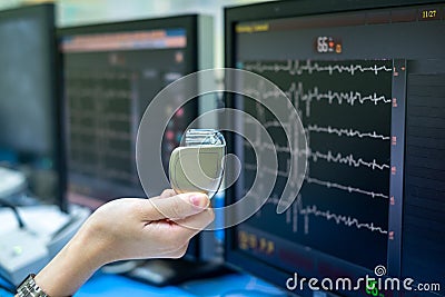 Doctor Hand hold Pacemaker device. Stock Photo