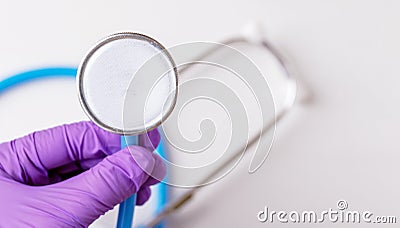 doctor hand in surgical gloves holding detach one anal or vaginal rectal suppositories anti fever virus constipation Stock Photo