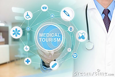 Doctor hand touching MEDICAL TOURISM sign virtual screen Stock Photo