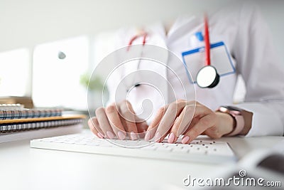 Doctor hands on white keyboard. Getting medical education Stock Photo