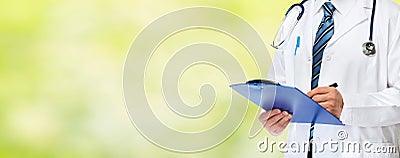 Doctor hands writing on clipboard Stock Photo