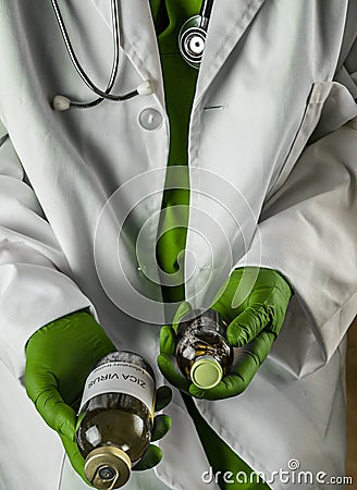 Doctor has in his hands ZICA virus vaccines in a hospital Stock Photo