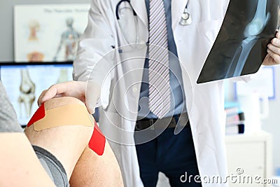 Doctor helping patient Stock Photo