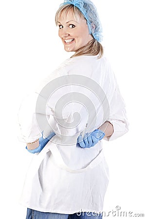 Doctor hiding a syringe Stock Photo