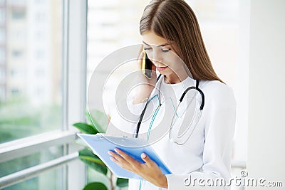 Doctor hold clipboard pad and fill medical history list Stock Photo