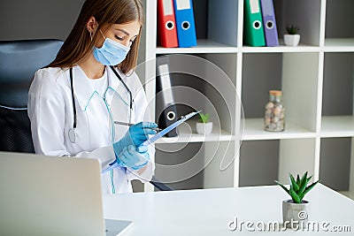 Doctor hold clipboard pad and fill medical history list Stock Photo