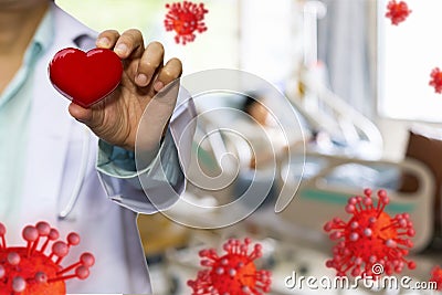 Doctor hold red heart and concept model covid 19 or coronavirus case of respiratory epidemic damage the lungs on blur background Stock Photo