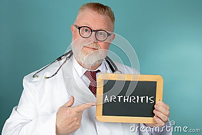 Doctor holding Arthritis lettering chalkboard Stock Photo