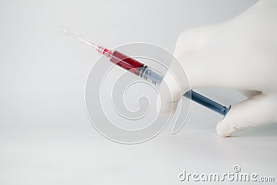 Doctor holding bloodsample isolated on a white background with copy space for advertisment Stock Photo