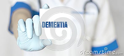 Doctor holding a card with text DEMENTIAL, medical concept Stock Photo