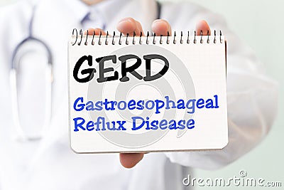 Doctor holding a card with text GERD Gastroesophageal Reflux Disease medical concept Stock Photo