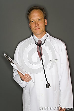 Doctor holding clipboard Stock Photo