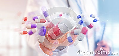 Doctor holding a 3d rendering group of medical pills Stock Photo