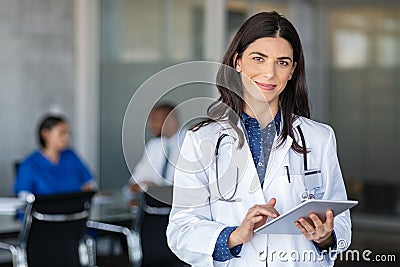 Doctor holding digital tablet at meeting room Stock Photo