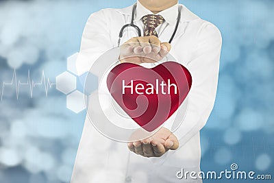 Doctor holding heart with health sign Stock Photo