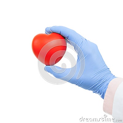 Doctor holding heart shaped toy in hand - close up Stock Photo