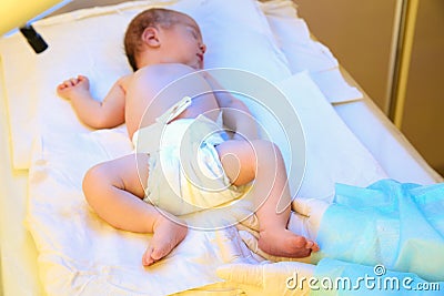 Doctor holding newborn child`s foot Stock Photo