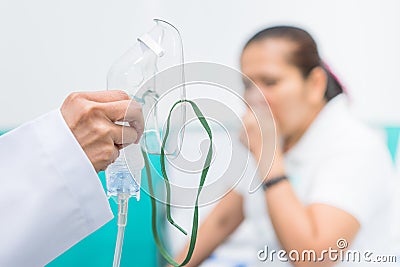 Doctor holding oxygen mask, Prepare inhaler for asthma patient. Stock Photo