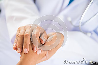 Doctor holding patient`s hand. Medicine and health care concept. Stock Photo