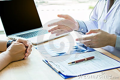 Doctor Holding Pens and Mentoring Patients, Treating Cancer and Introducing, Stock Photo