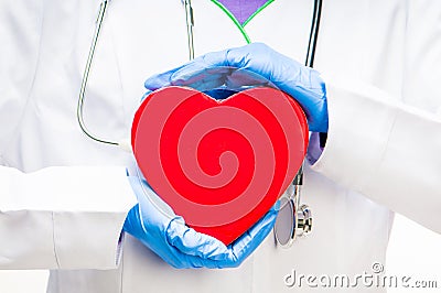 Doctor holding red heart Stock Photo