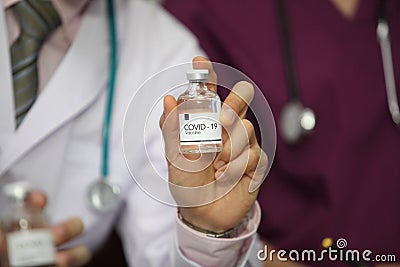 Doctor holding sample covid-19 vaccine vial Stock Photo